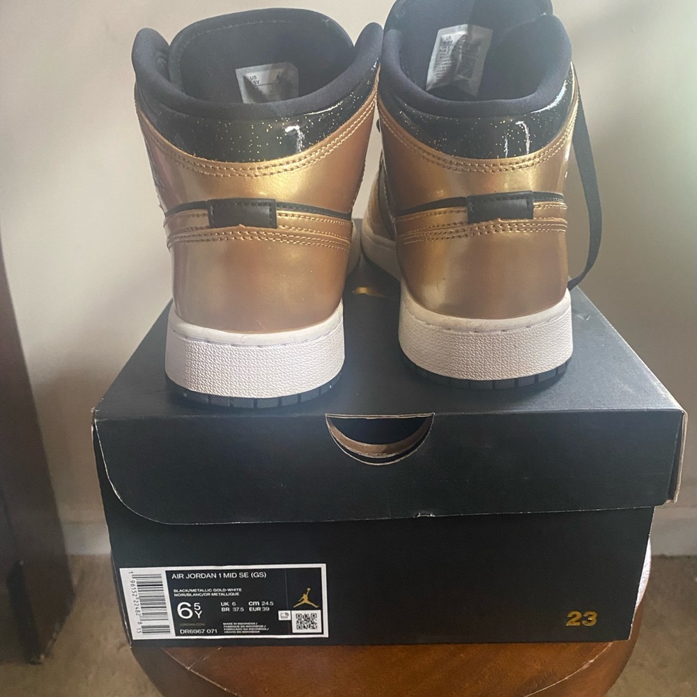 Jordan Black and Gold Sneakers High-Top Striking Design